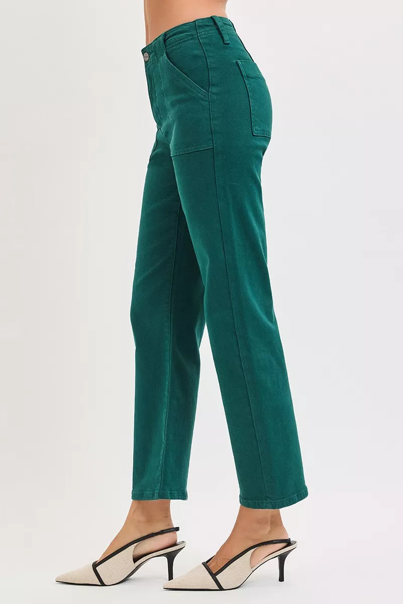 Woman wearing emerald green high-rise corduroy pants with patch pockets and ankle-flare fit — winter chic look from A Whimsical Affair.