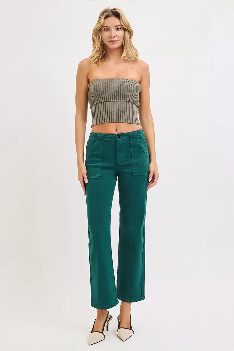 Woman wearing emerald green high-rise corduroy pants with patch pockets and ankle-flare fit — winter chic look from A Whimsical Affair.