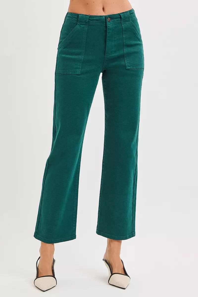Woman wearing emerald green high-rise corduroy pants with patch pockets and ankle-flare fit — winter chic look from A Whimsical Affair.