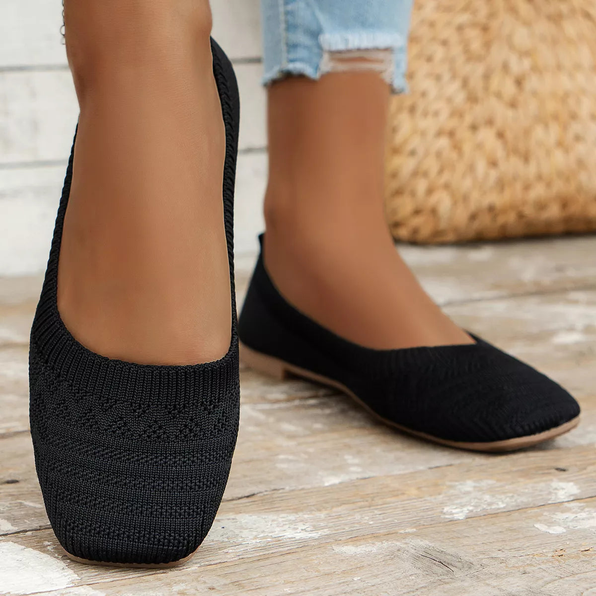 Black knit square toe slip-on flats with low heel, displayed for casual everyday wear.