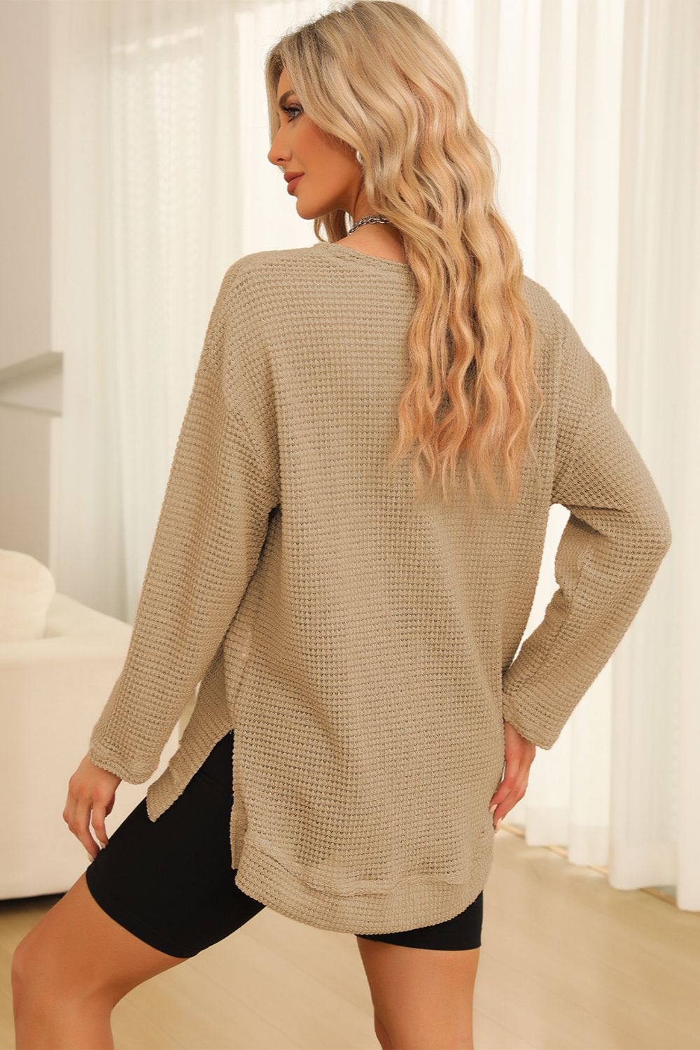 Everyday Ease waffle knit pullover with relaxed fit and side slit detail styled with denim shorts