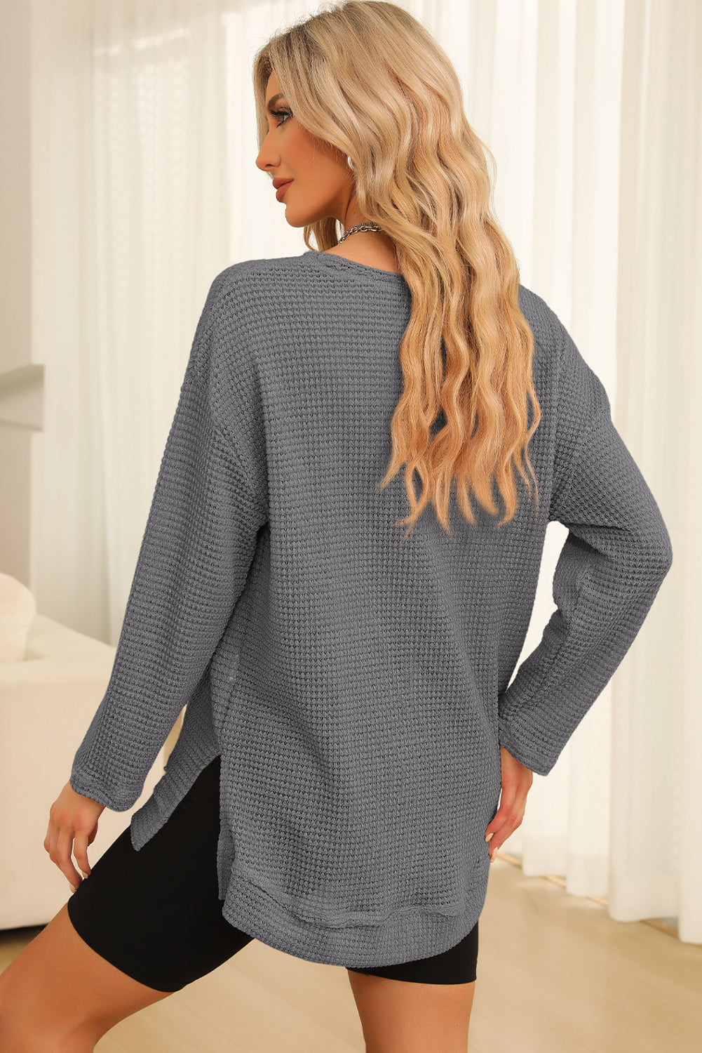 Everyday Ease waffle knit pullover with relaxed fit and side slit detail styled with denim shorts