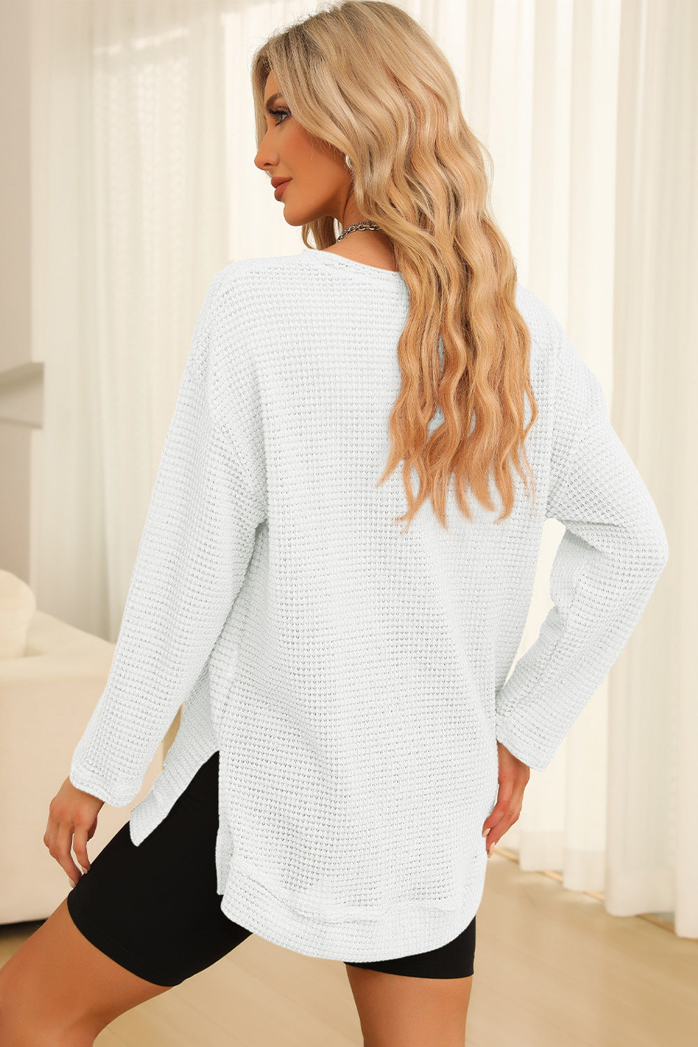 Everyday Ease waffle knit pullover with relaxed fit and side slit detail styled with denim shorts