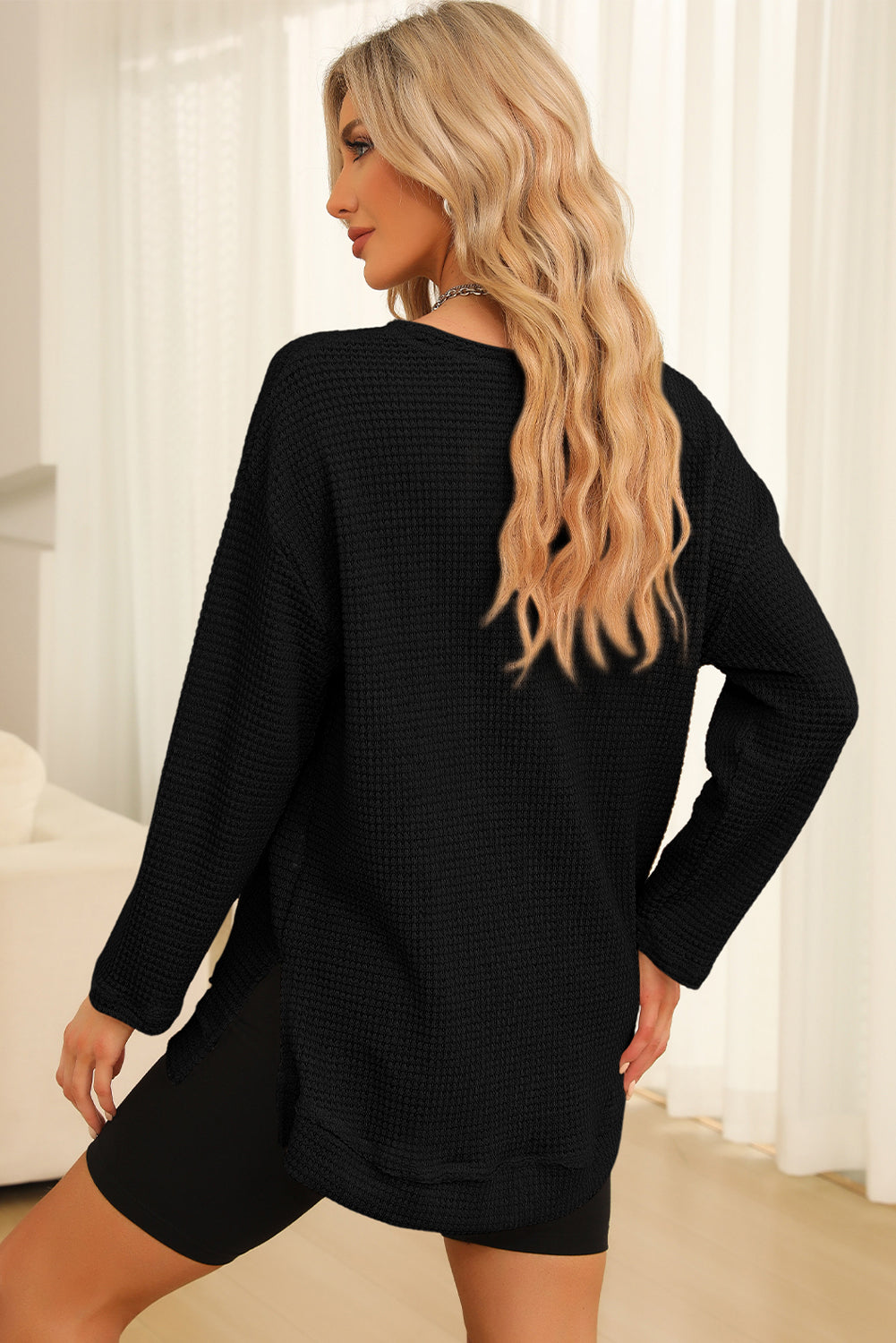 Everyday Ease waffle knit pullover with relaxed fit and side slit detail styled with denim shorts