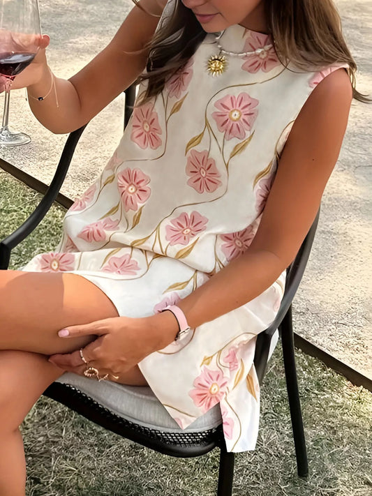 Sleeveless floral mini dress with relaxed swing silhouette and lightweight fabric.