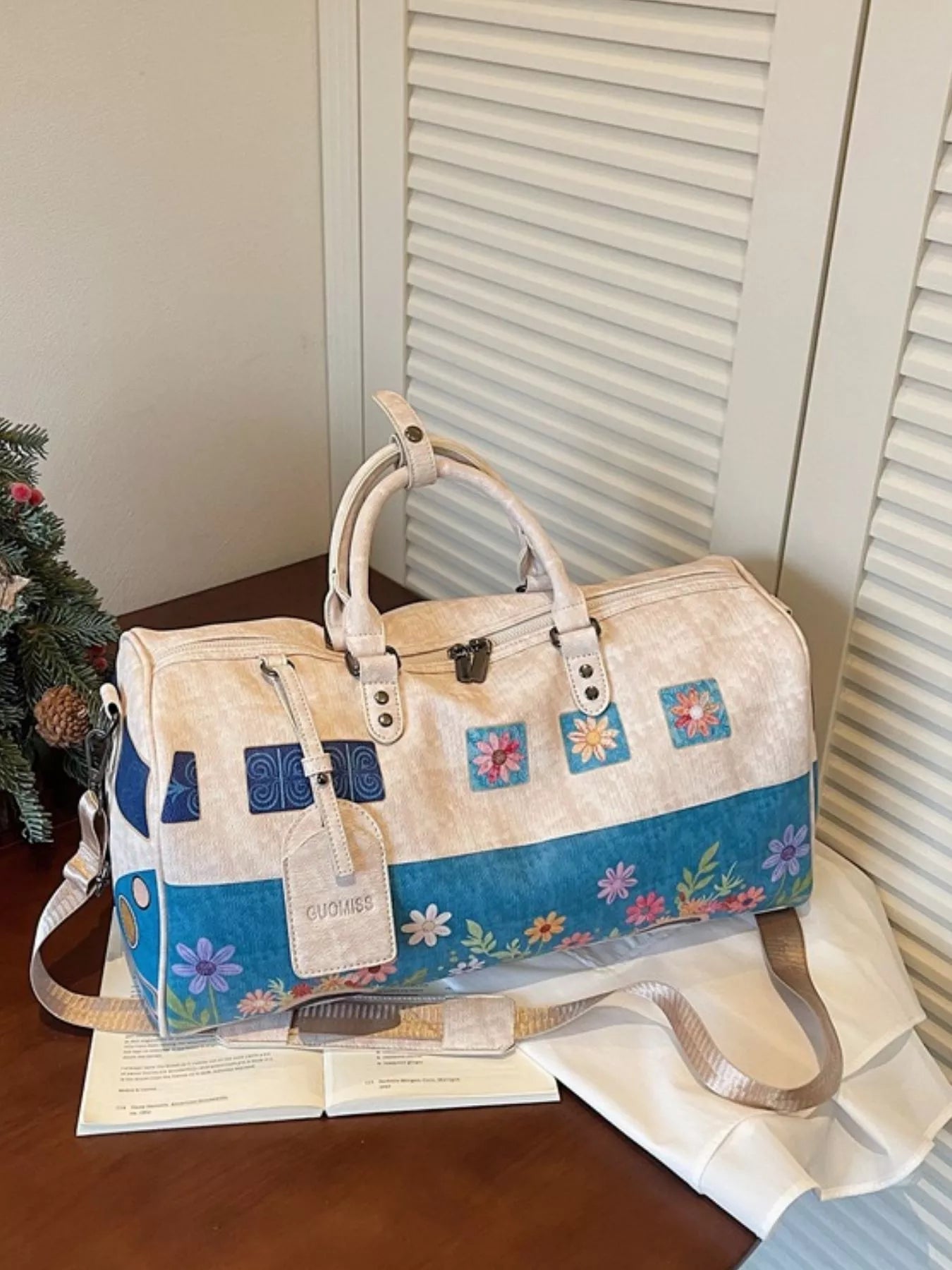 Large flower power microbus weekender bag with blue retro van design, floral details, handles, and shoulder strap.