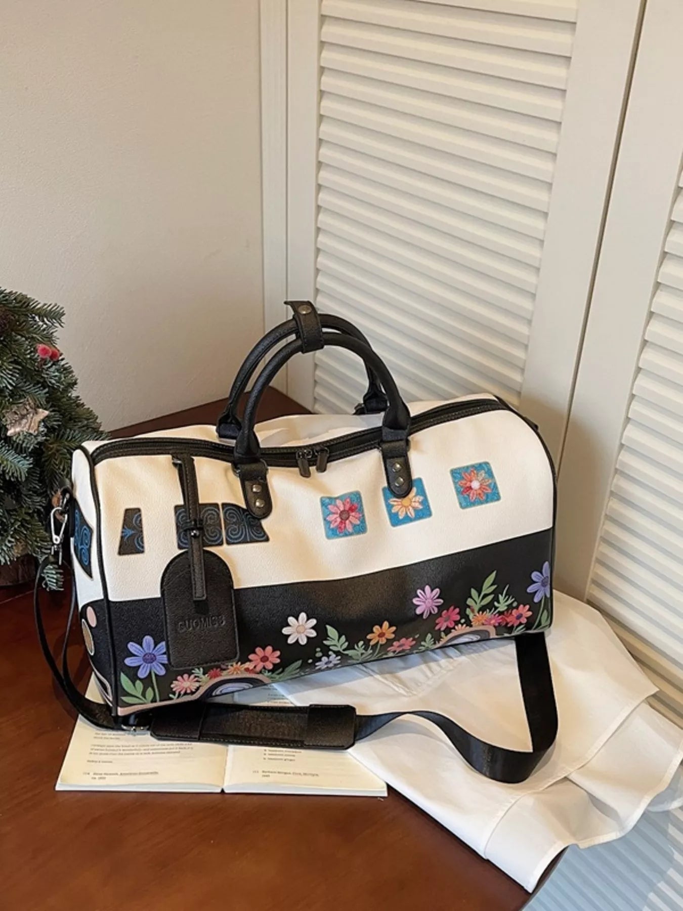 Large flower power microbus weekender bag with blue retro van design, floral details, handles, and shoulder strap.