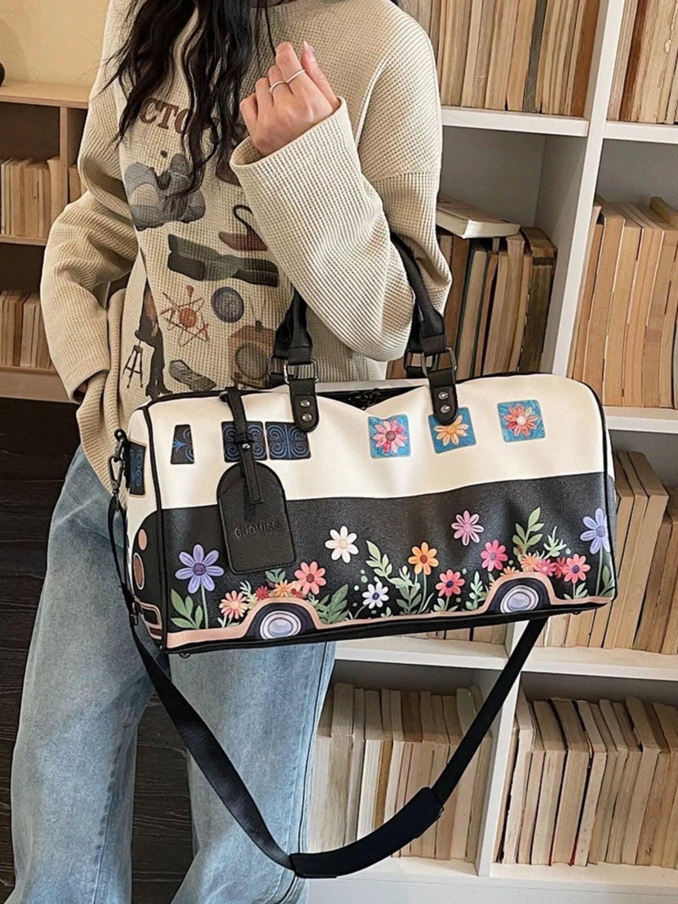 Large flower power microbus weekender bag with blue retro van design, floral details, handles, and shoulder strap.