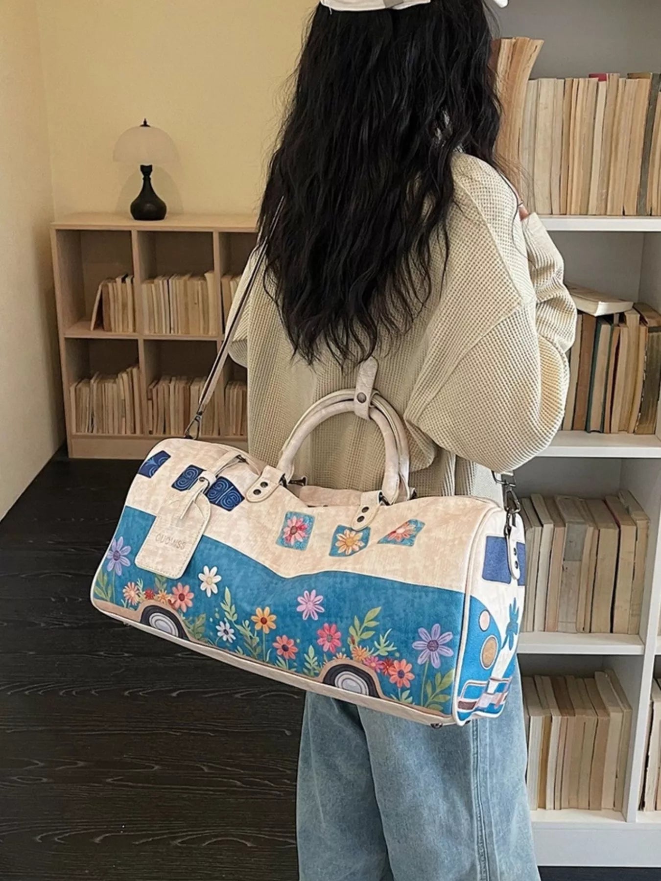 Large flower power microbus weekender bag with blue retro van design, floral details, handles, and shoulder strap.