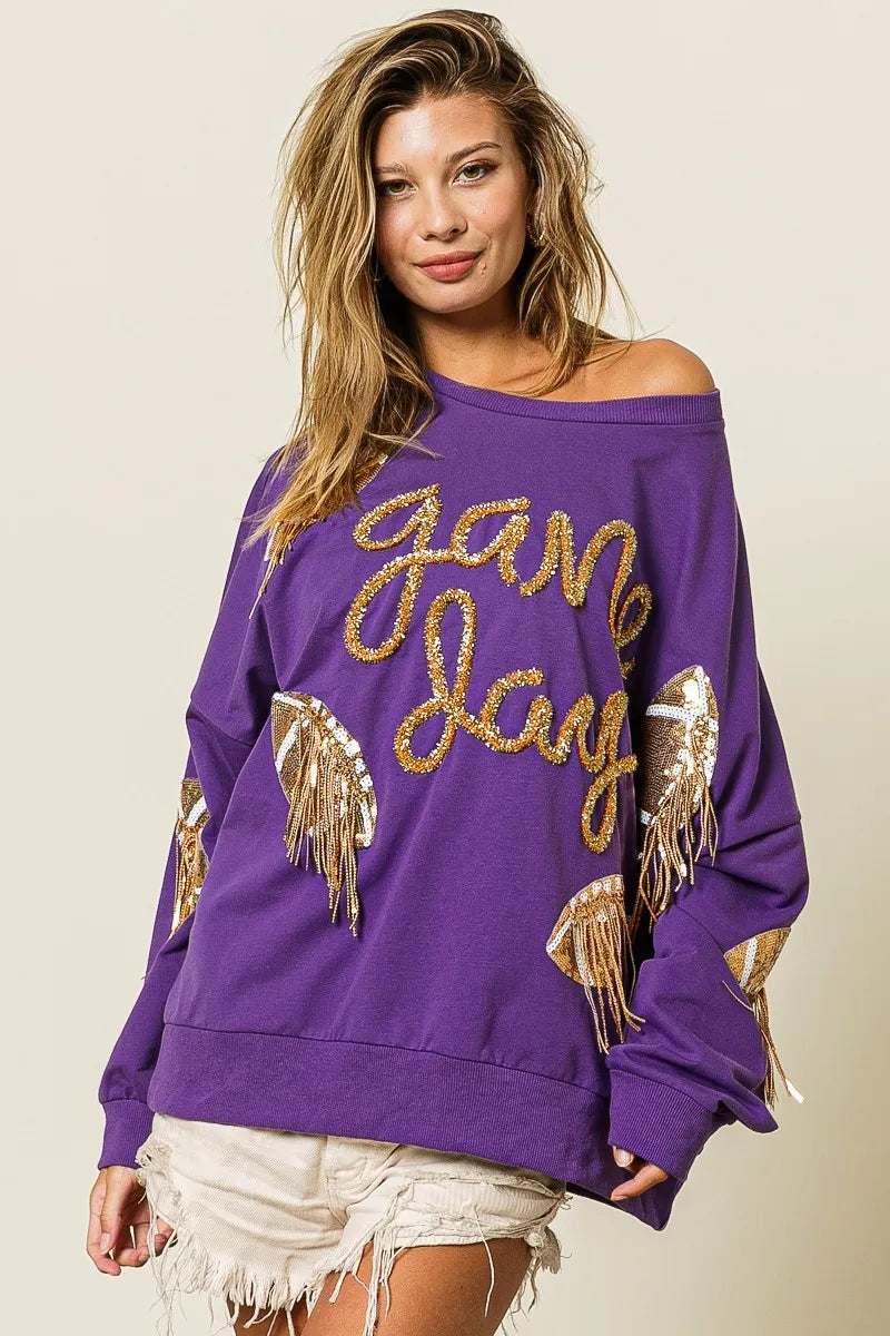 Purple sequin football patch game day sweatshirt with gold sequin lettering, oversized fit, and cozy long sleeves