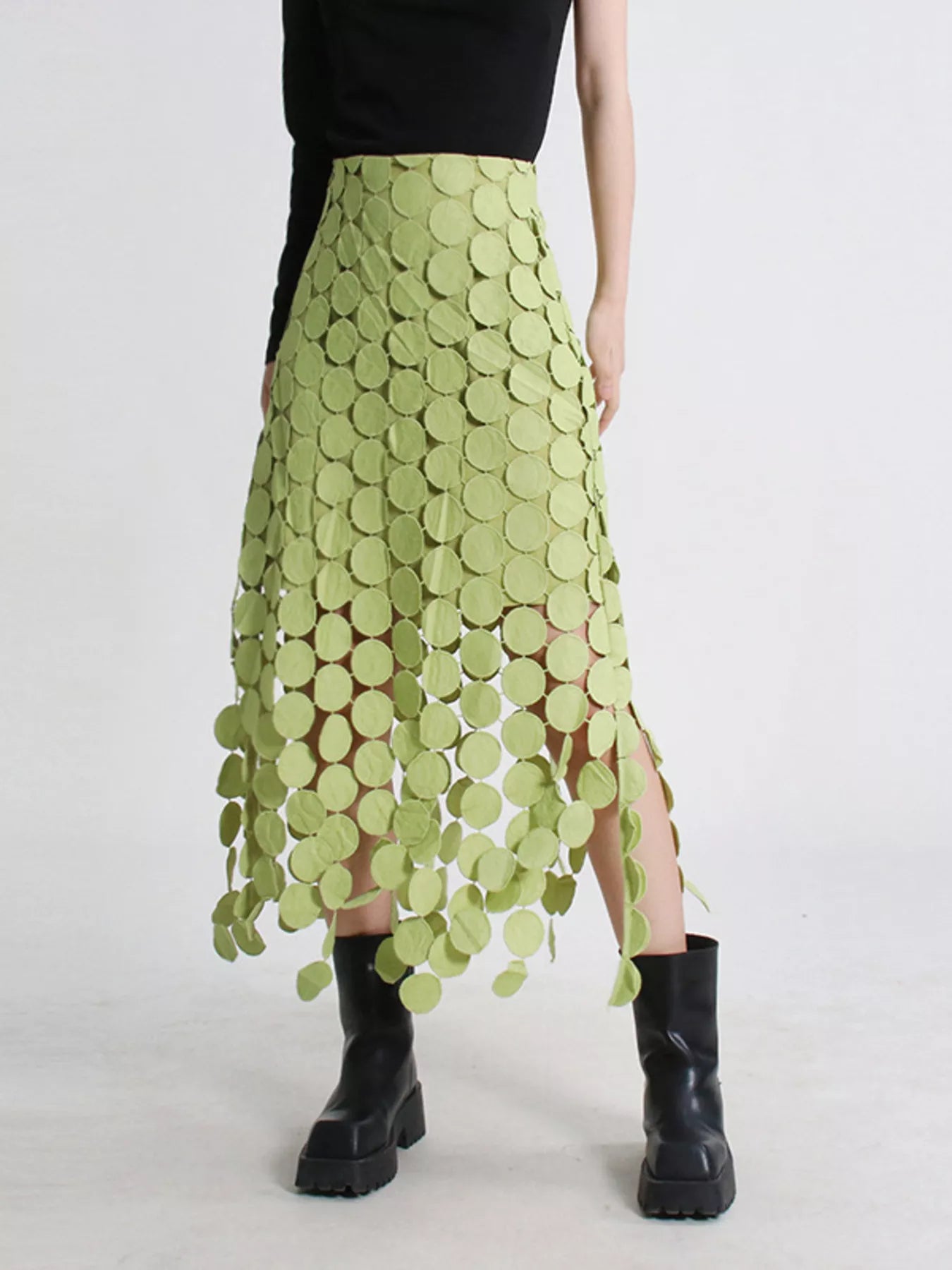 Green fringe midi skirt with cutout circles and flowing fringe detail