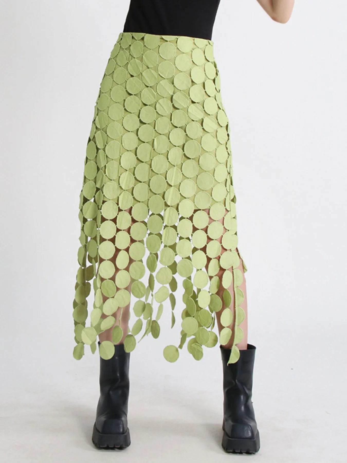 Green fringe midi skirt with cutout circles and flowing fringe detail