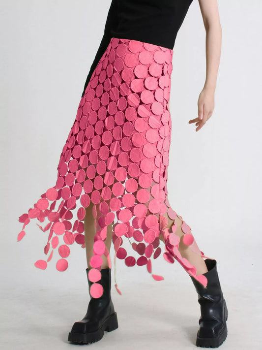 Pink fringe midi skirt with circular cutouts and asymmetrical hem