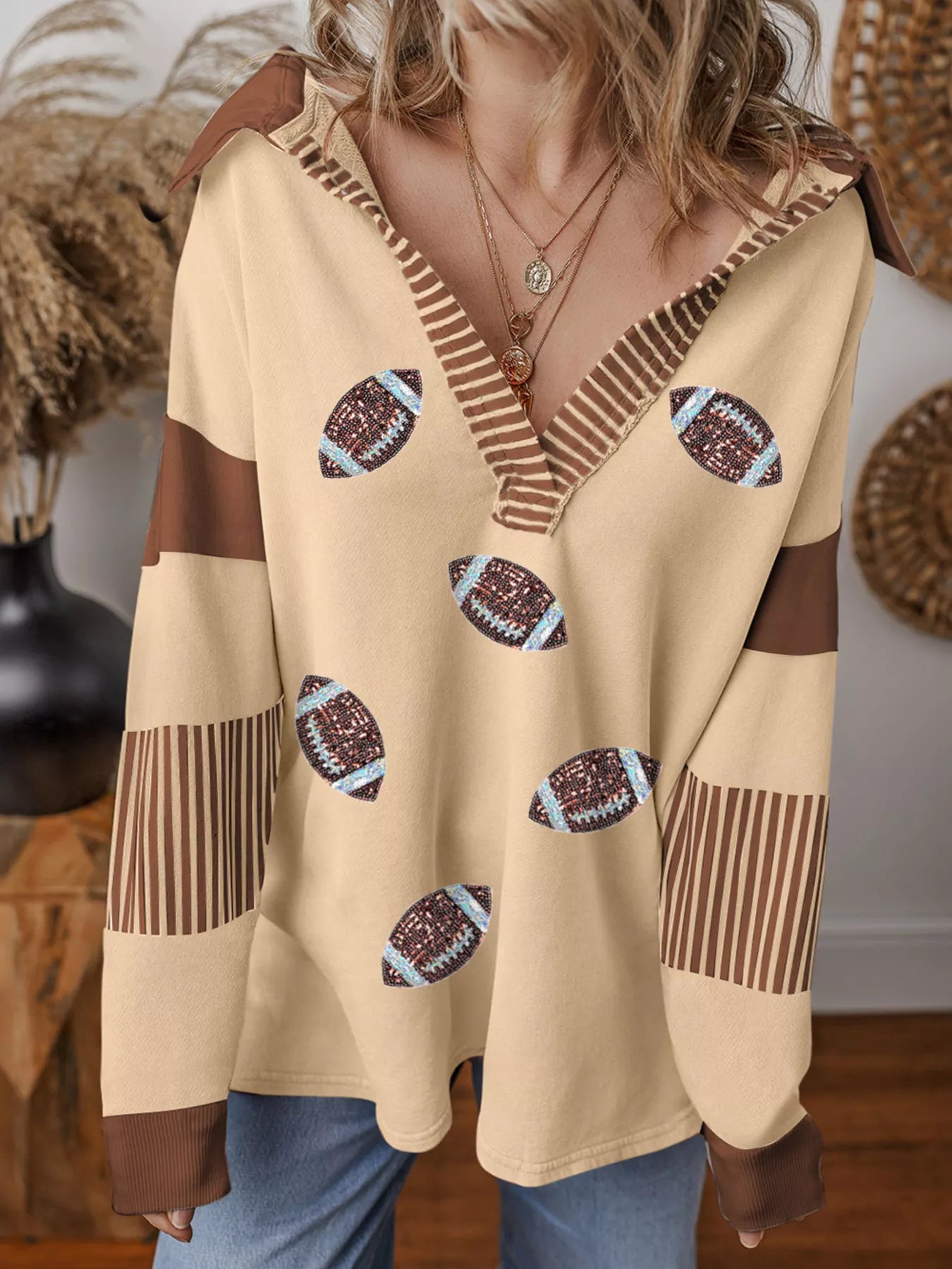 Game Day Sparkle Sweatshirt with sequin football graphics and color block polo design