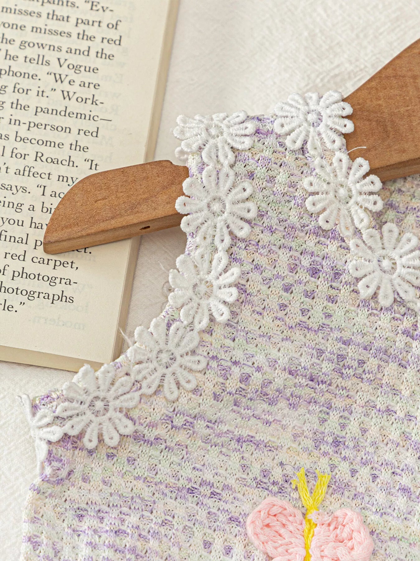 Two-piece baby outfit with textured appliqué sleeveless top, daisy trim neckline, and lavender flowy shorts.