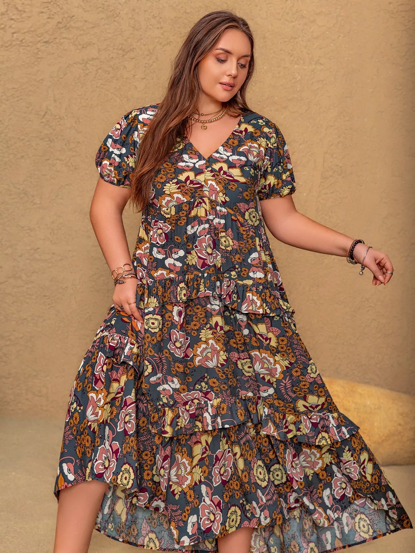 Plus size boho floral midi dress with short puff sleeves, ruffled tiers, and flowy fit