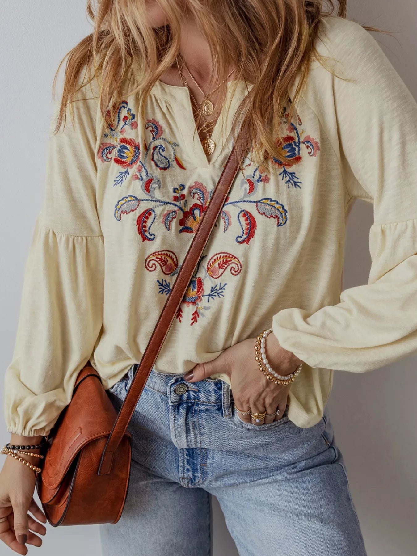 Cream boho peasant blouse with colorful floral embroidery and balloon sleeves