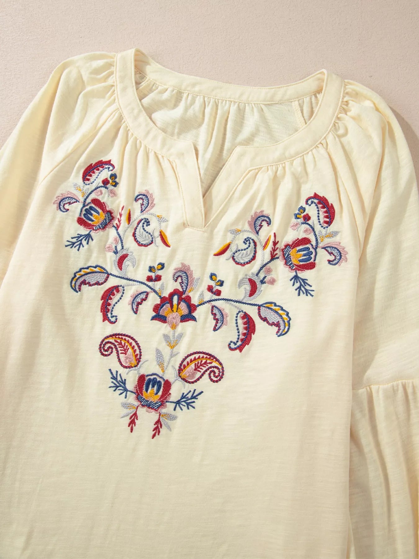 Cream boho peasant blouse with colorful floral embroidery and balloon sleeves