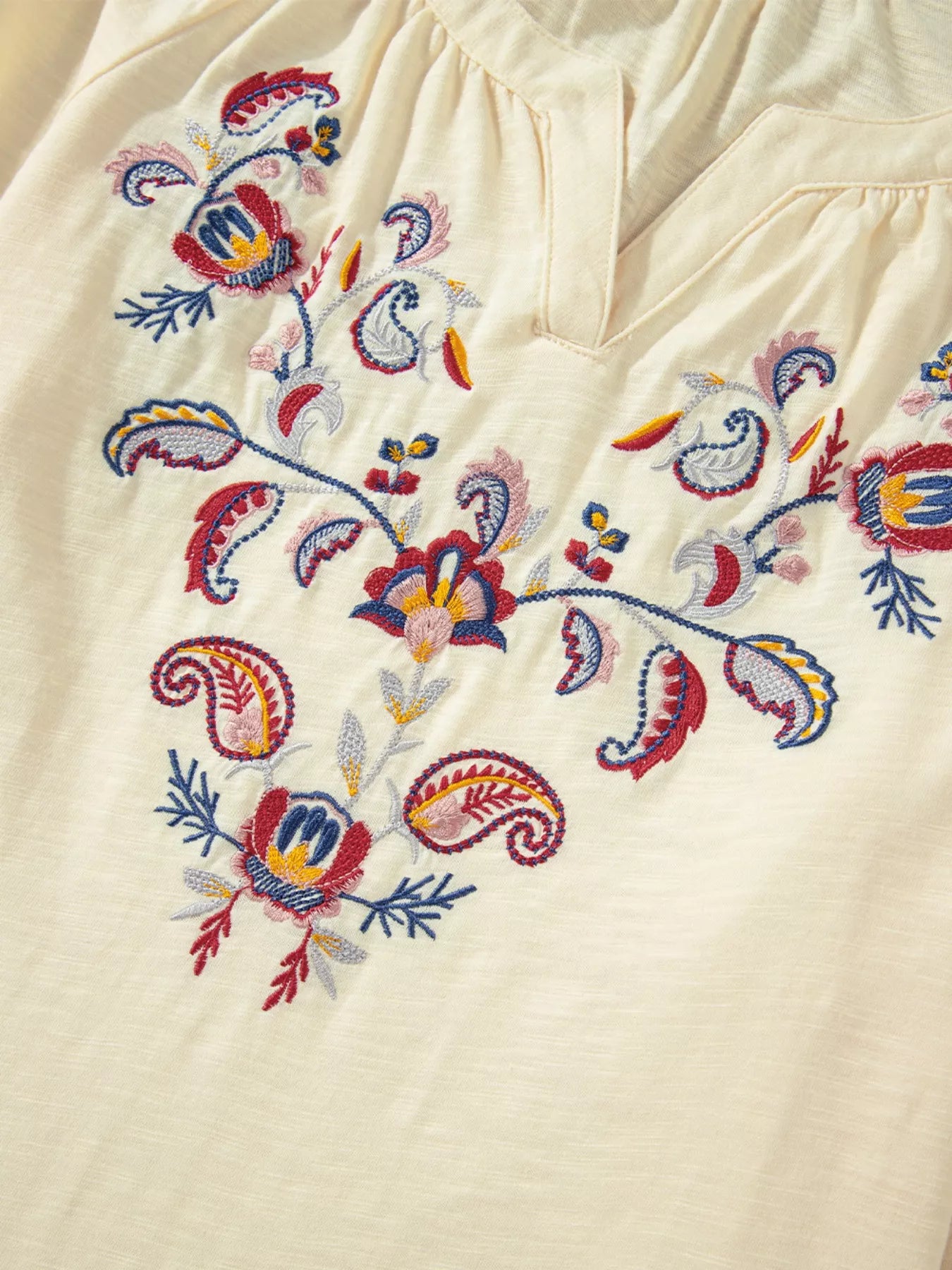 Cream boho peasant blouse with colorful floral embroidery and balloon sleeves