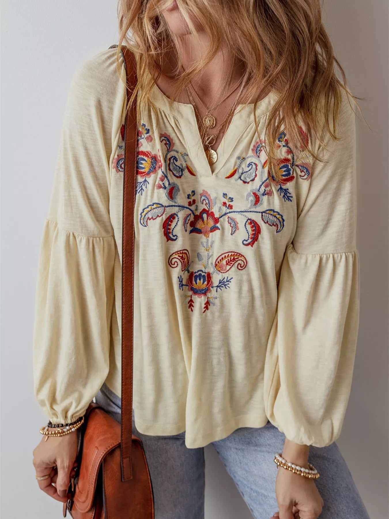 Cream boho peasant blouse with colorful floral embroidery and balloon sleeves