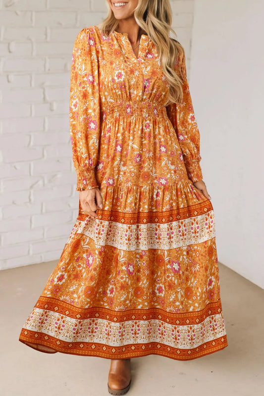 Golden floral smocked boho maxi dress with long sleeves and flowing skirt