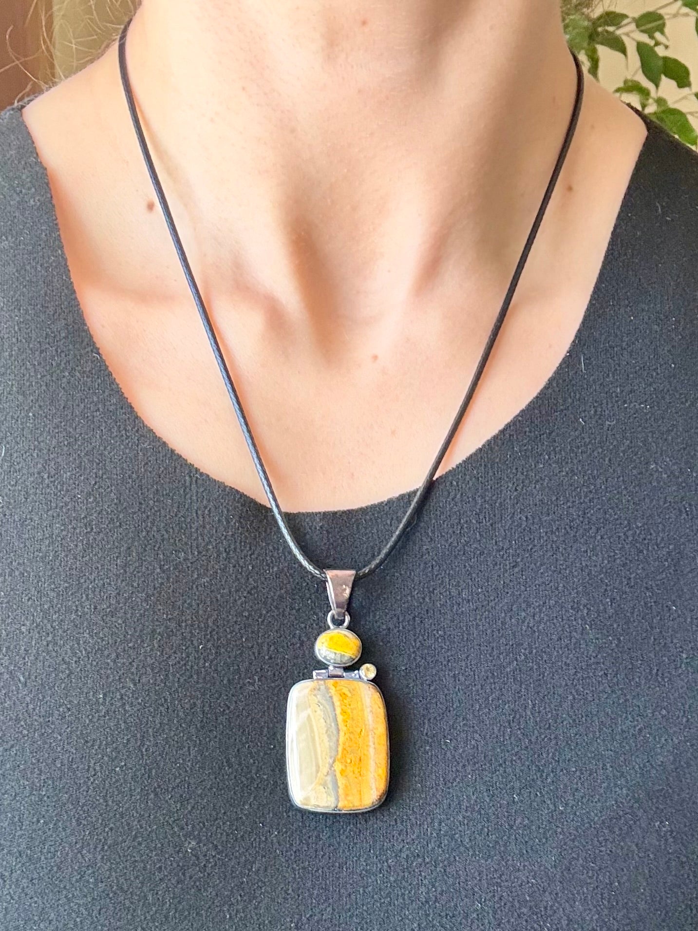 Sterling silver bumble bee jasper pendant featuring natural golden yellow and gray banded stone.