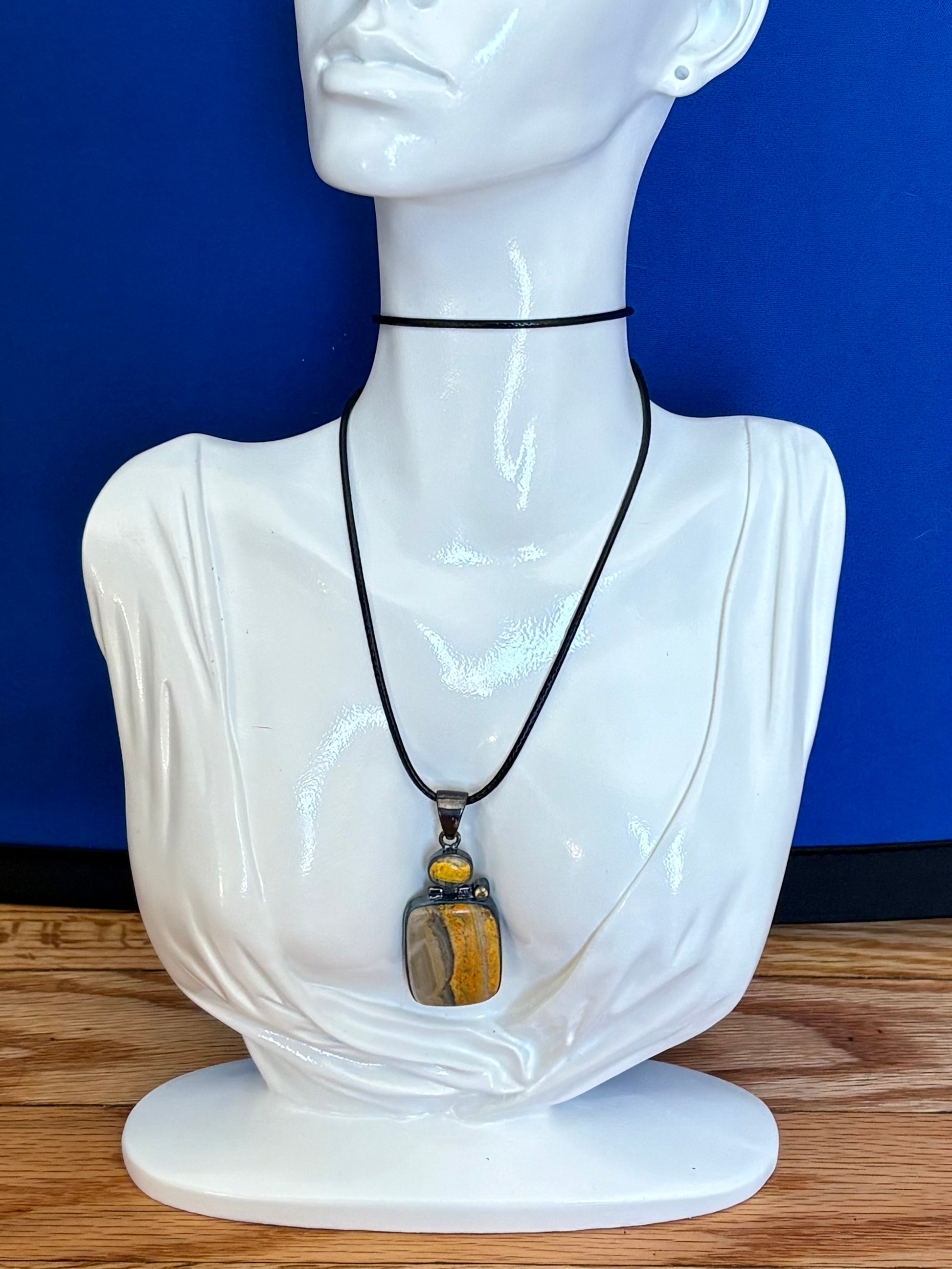 Sterling silver bumble bee jasper pendant featuring natural golden yellow and gray banded stone.