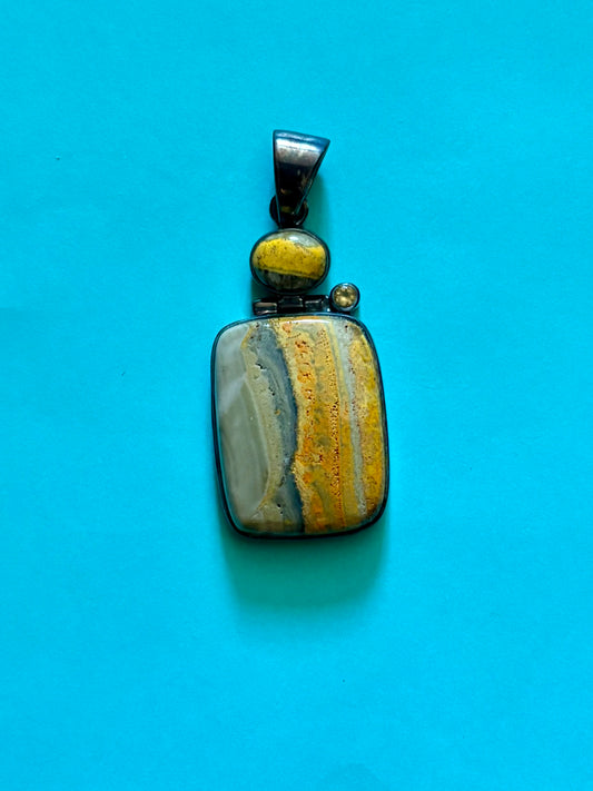 Sterling silver bumble bee jasper pendant featuring natural golden yellow and gray banded stone.