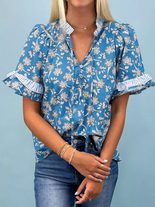 Blue floral cotton blouse with striped ruffle trim and tie neckline