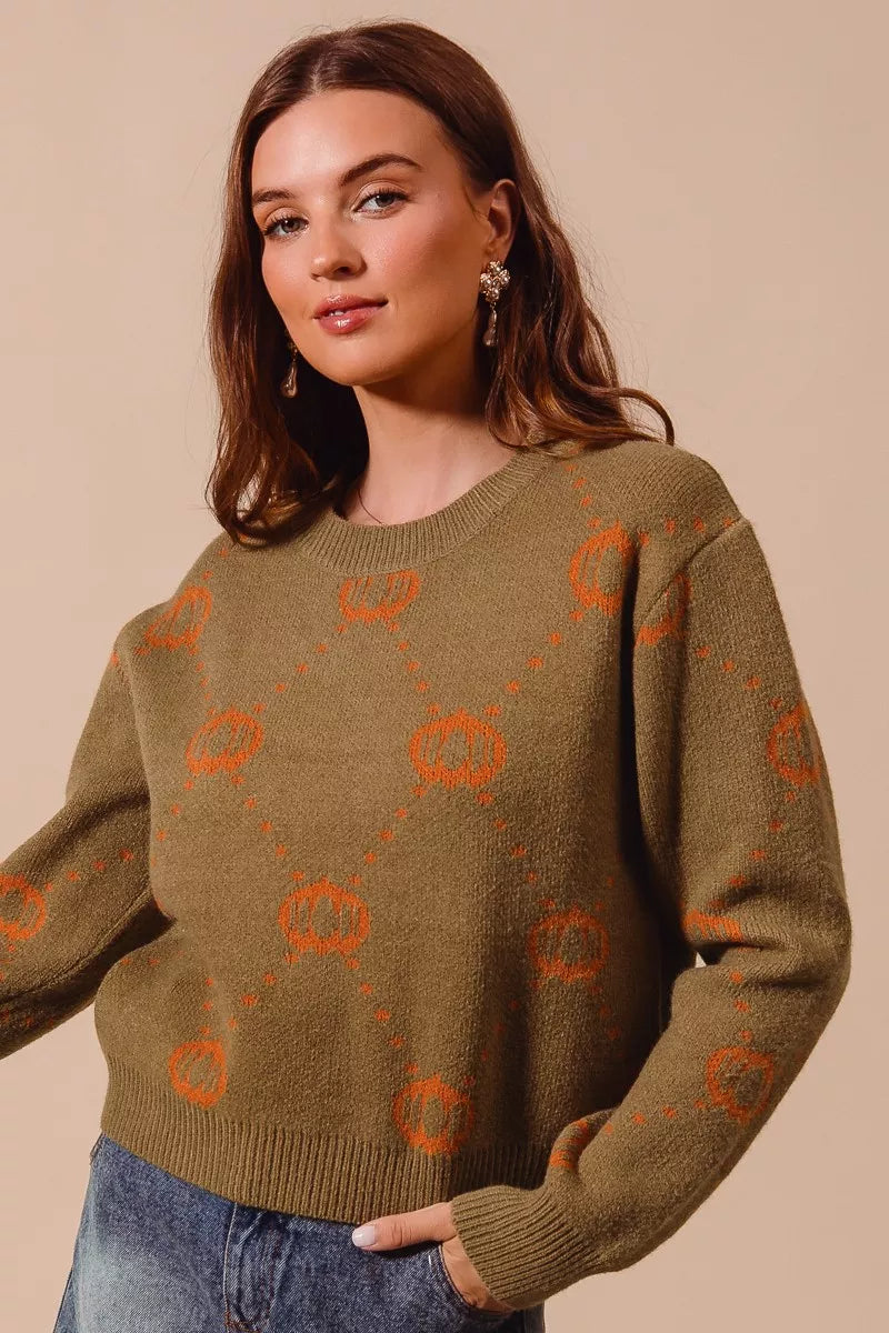 Harvest Hues Sweater – oversized knit with pumpkin rhombus pattern, cozy fall design for Halloween and Thanksgiving.