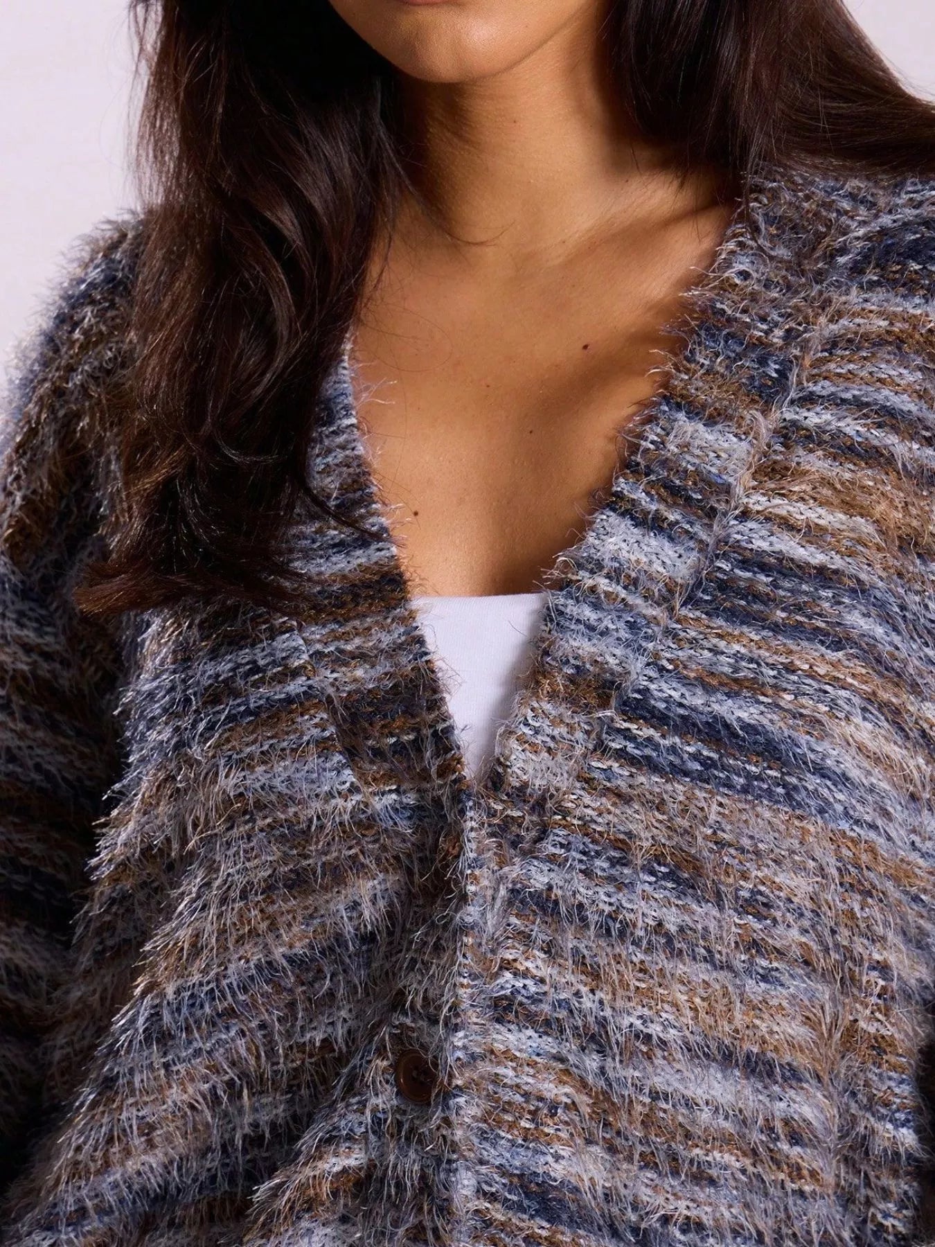 Soft textured button-front cardigan with a fluffy, multicolored knit and relaxed fit.