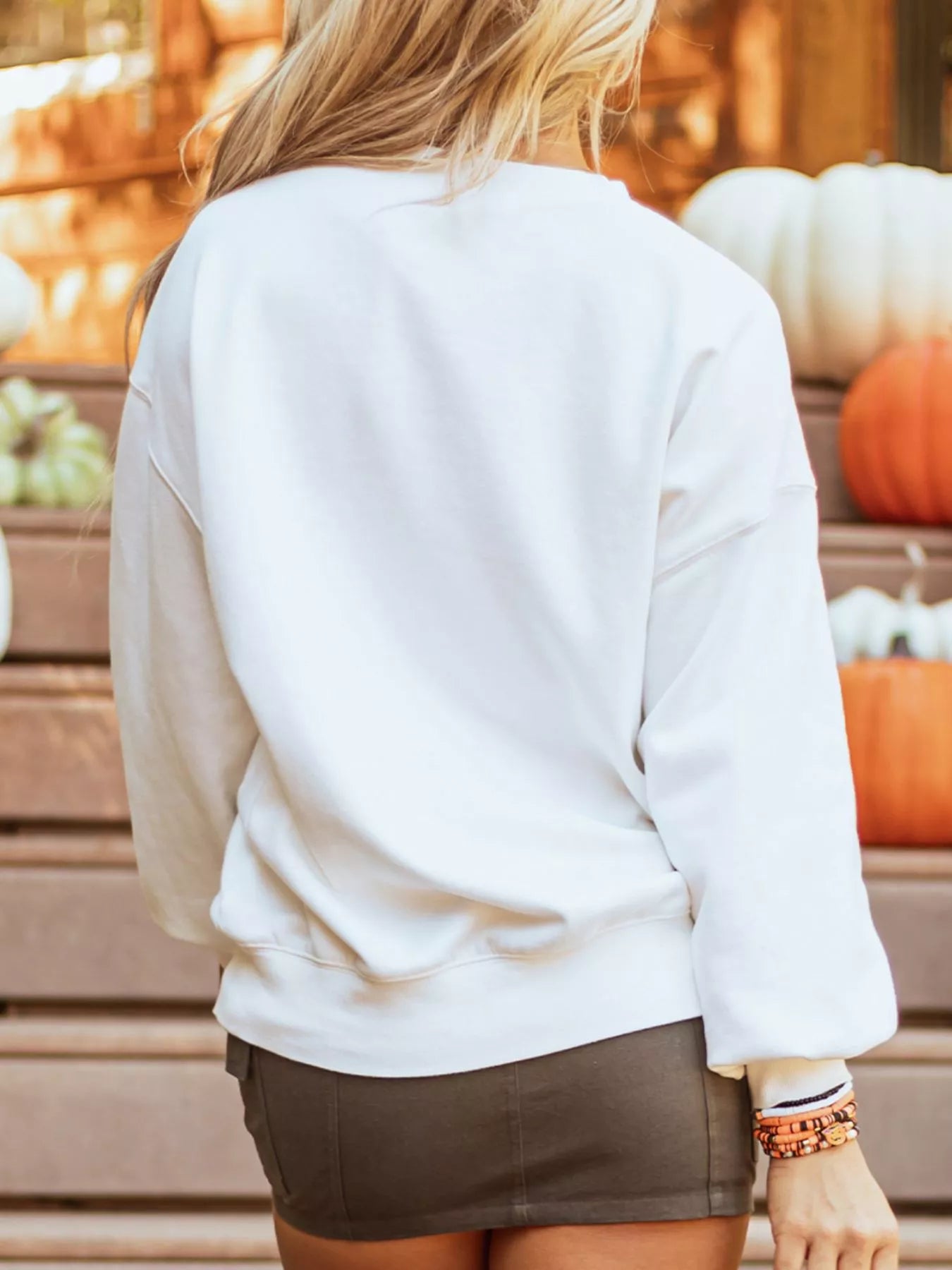 White sweatshirt with retro “Hello Pumpkin” lettering inside checkerboard pumpkin graphic – Retro Pumpkin style from A Whimsical Affair.
