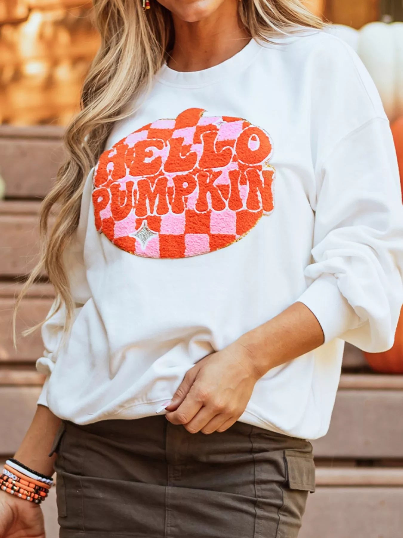 White sweatshirt with retro “Hello Pumpkin” lettering inside checkerboard pumpkin graphic – Retro Pumpkin style from A Whimsical Affair.