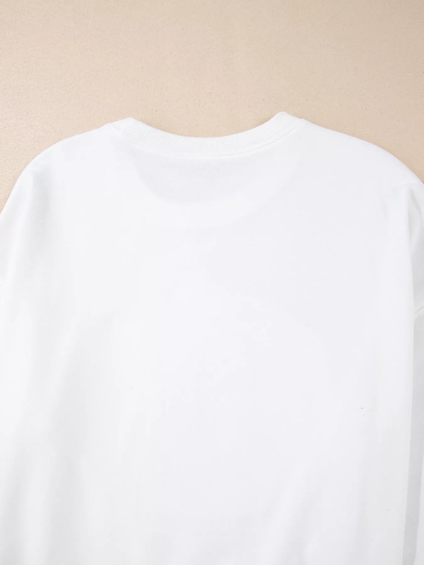 White sweatshirt with retro “Hello Pumpkin” lettering inside checkerboard pumpkin graphic – Retro Pumpkin style from A Whimsical Affair.
