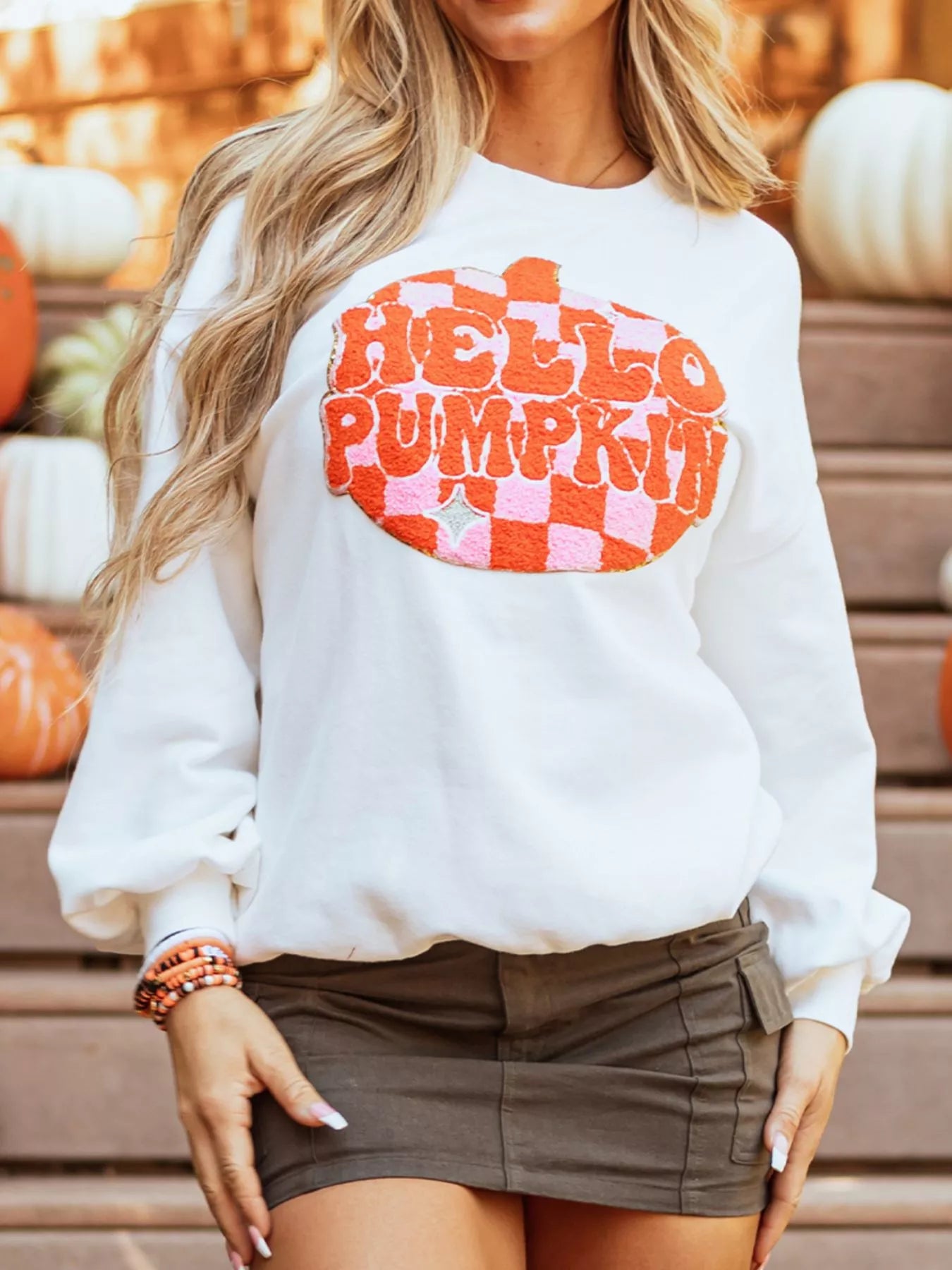 White sweatshirt with retro “Hello Pumpkin” lettering inside checkerboard pumpkin graphic – Retro Pumpkin style from A Whimsical Affair.