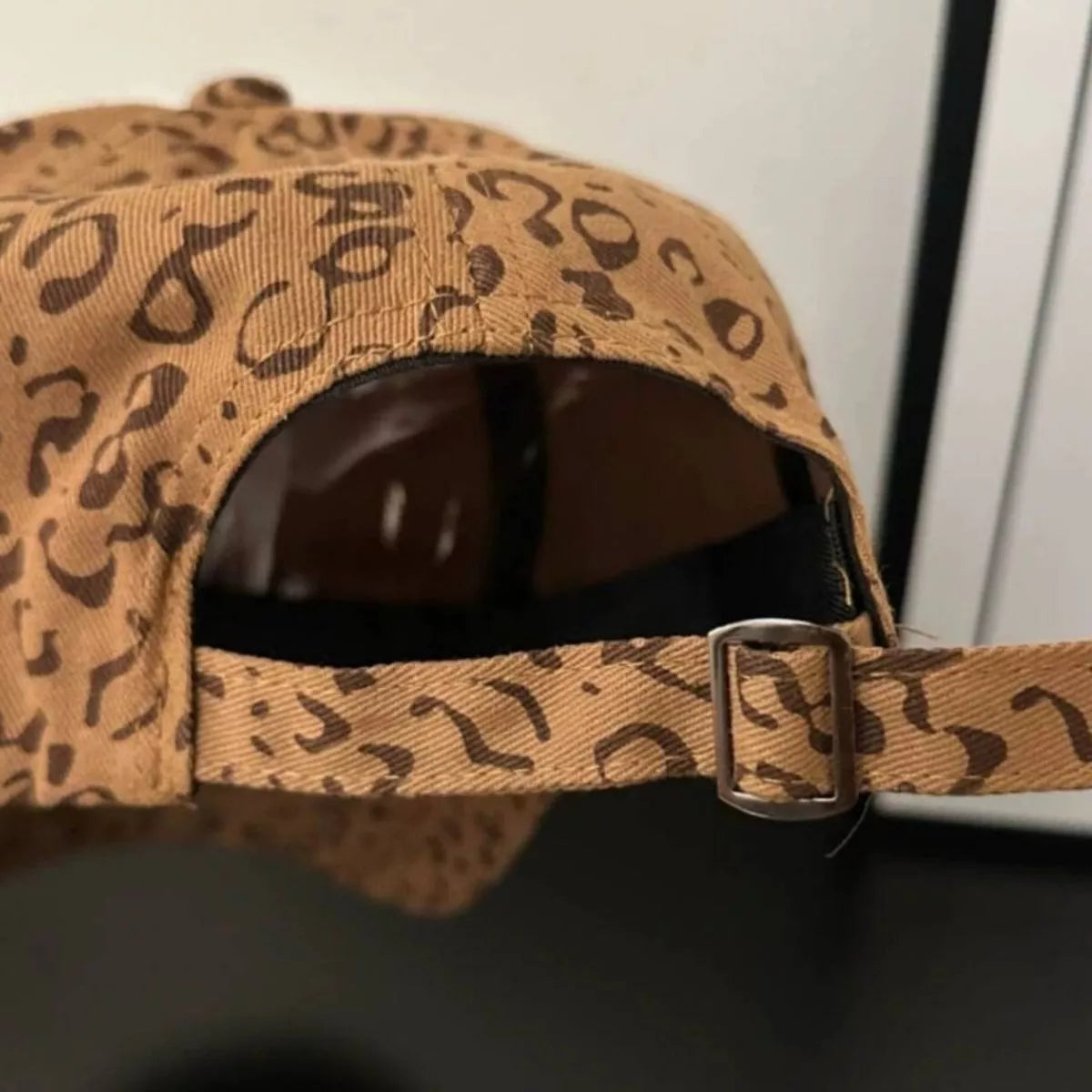 Tan leopard print cotton baseball cap with two-tone brim and embroidered Hello Summer kitty patch on the front.