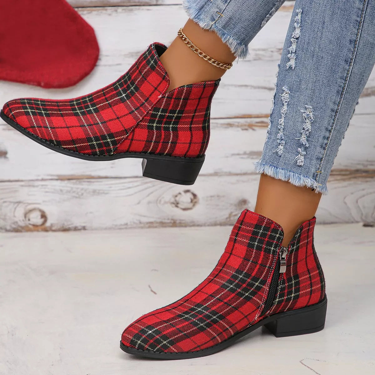 Vintage-inspired plaid ankle boots with a low heel styled with cropped denim
