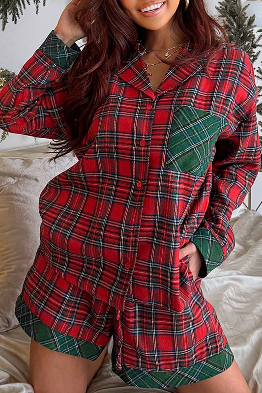 Model wearing red plaid button-down pajama set with green contrast pocket and shorts.
