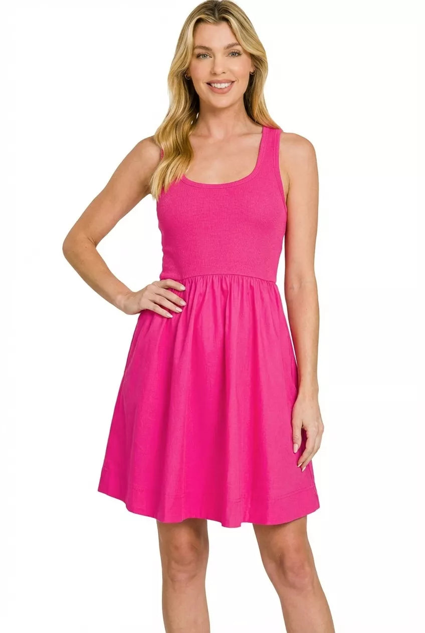 Hot pink sleeveless knit and woven midi dress with fitted bodice and flowy cotton skirt