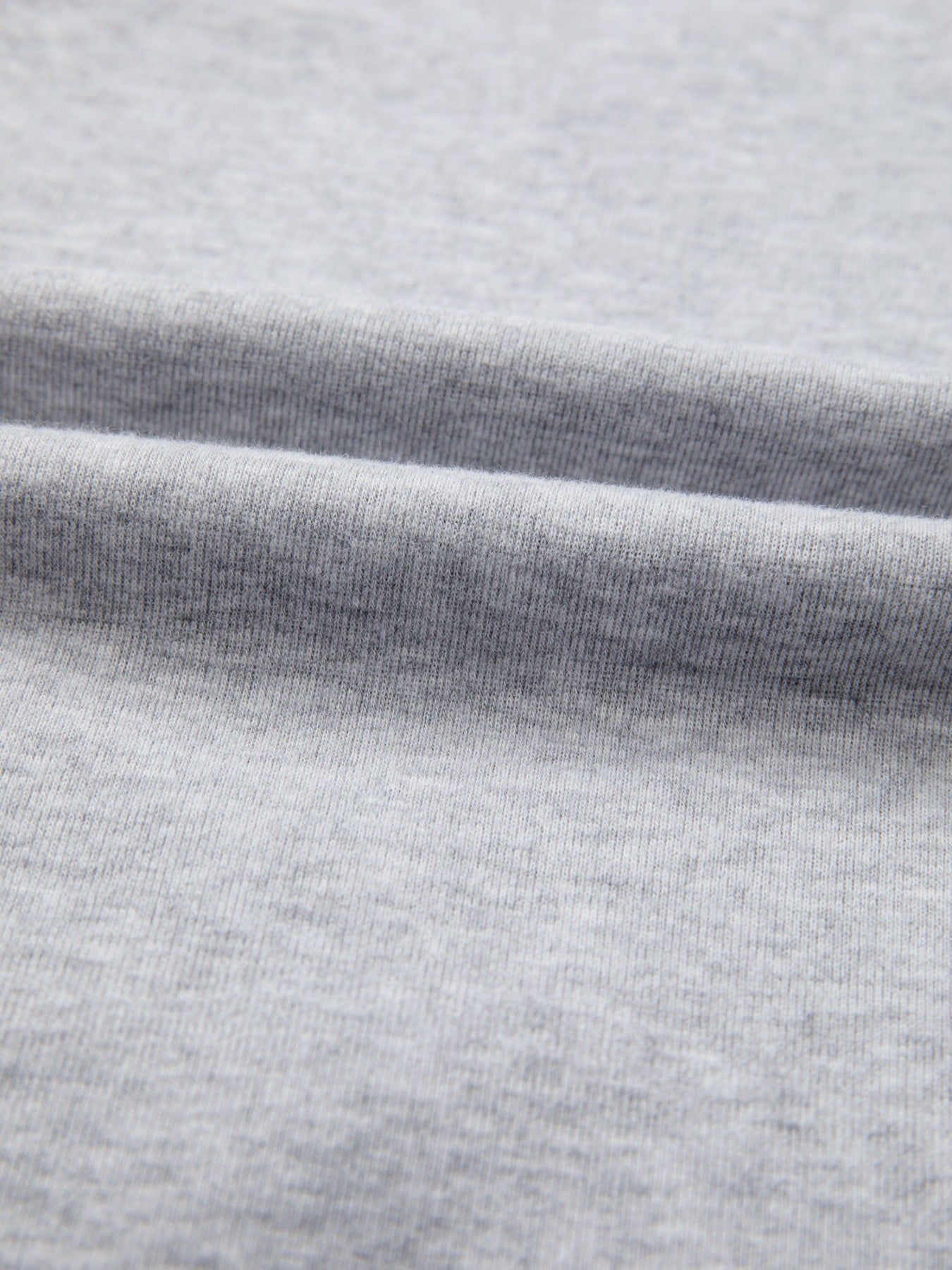 Gray raglan top with navy embroidered floral appliqué