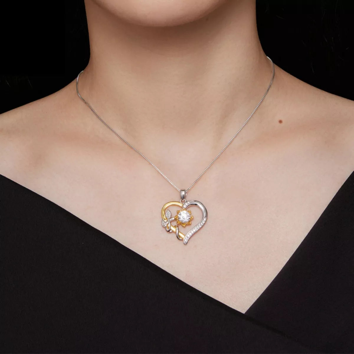 Intertwined heart pendant necklace with 1 carat moissanite in platinum-plated sterling silver