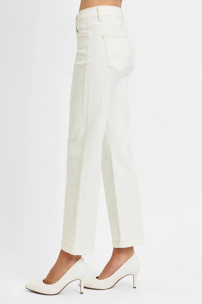 Woman wearing Ivory Edge Straight Jeans with mid rise tummy control and ankle length cut.
