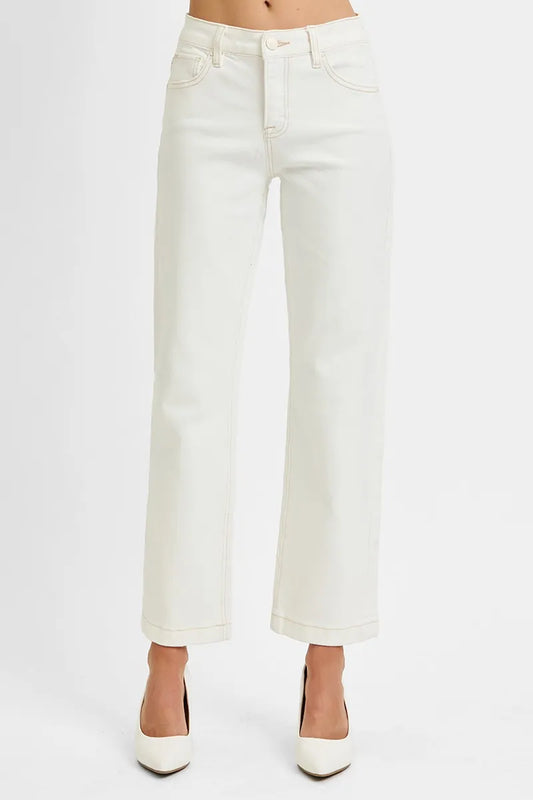 Woman wearing Ivory Edge Straight Jeans with mid rise tummy control and ankle length cut.