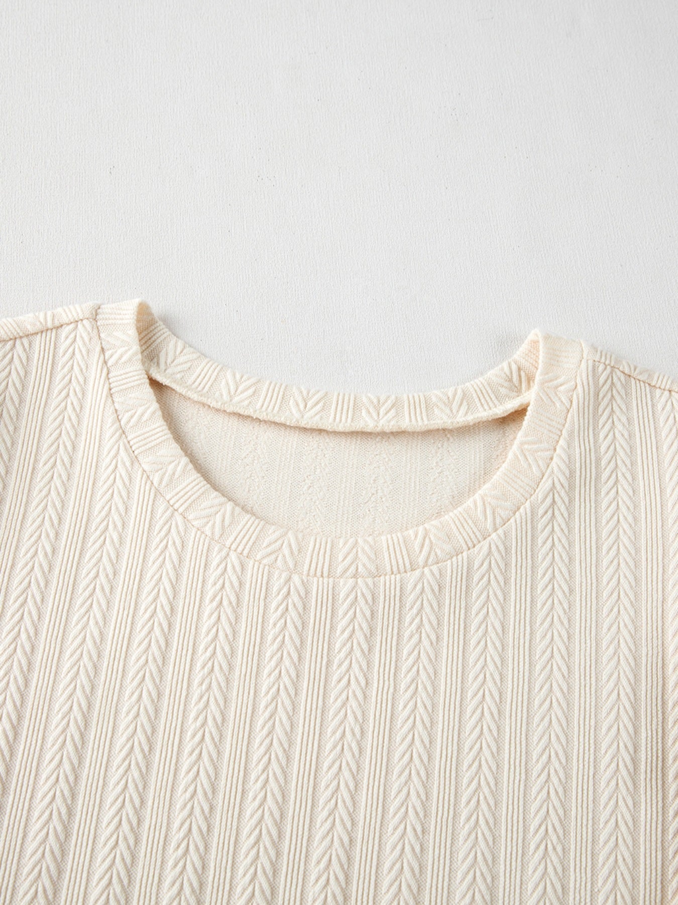 Ivory textured blouse with sheer puff sleeves and dotted detail