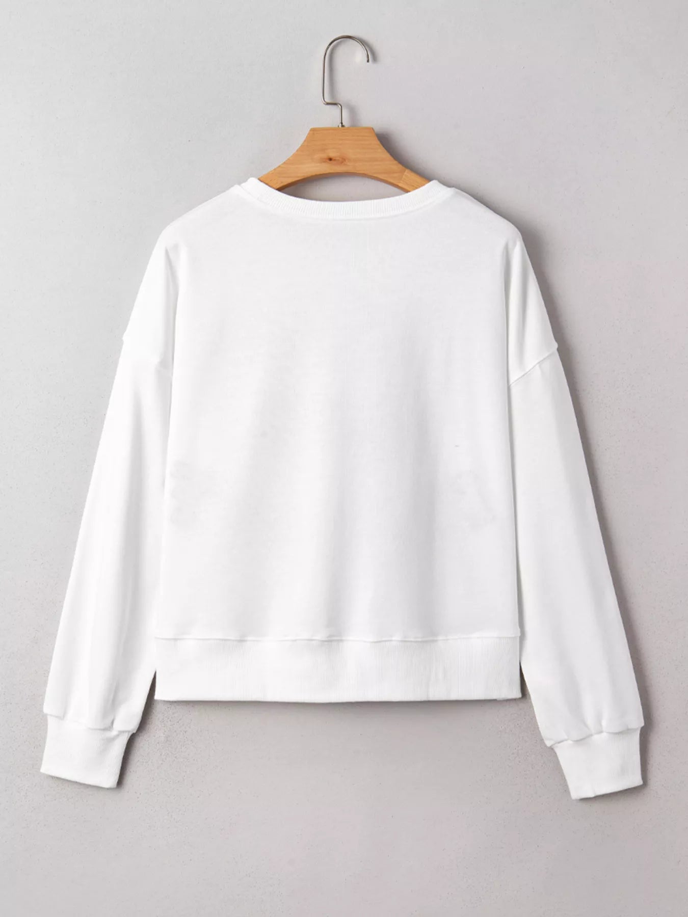White Kickoff Queen sweatshirt with bold varsity lettering, cozy oversized fit, and casual sporty game day style.