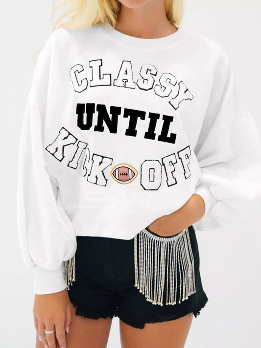 White Kickoff Queen sweatshirt with bold varsity lettering, cozy oversized fit, and casual sporty game day style.