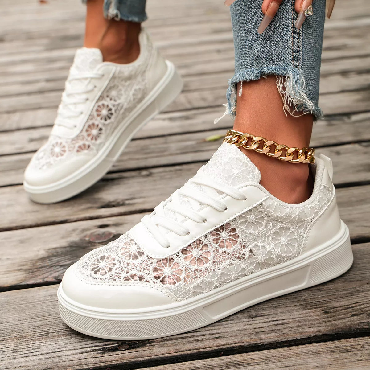 Floral lace mesh sneaker flats with lace-up design, flat heel, rubber sole, and casual everyday styling shown in black and white.