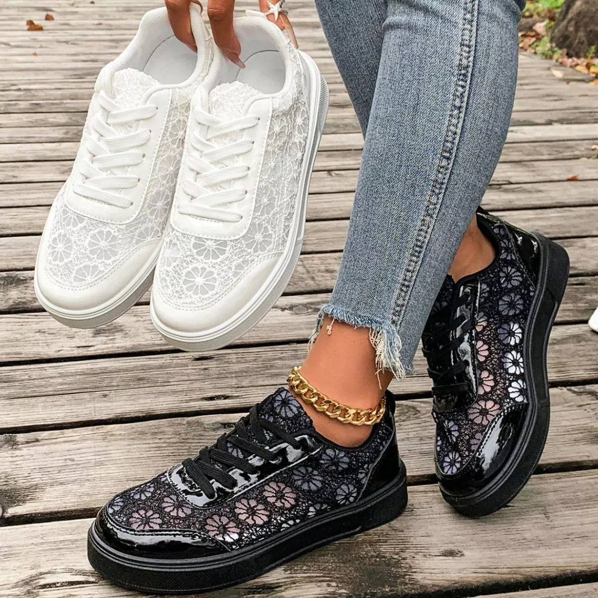 Floral lace mesh sneaker flats with lace-up design, flat heel, rubber sole, and casual everyday styling shown in black and white.