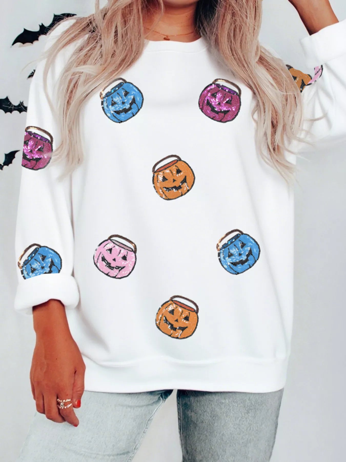 Halloween sweatshirt with sequin pumpkin lantern patches – Lantern Glow style from A Whimsical Affair.