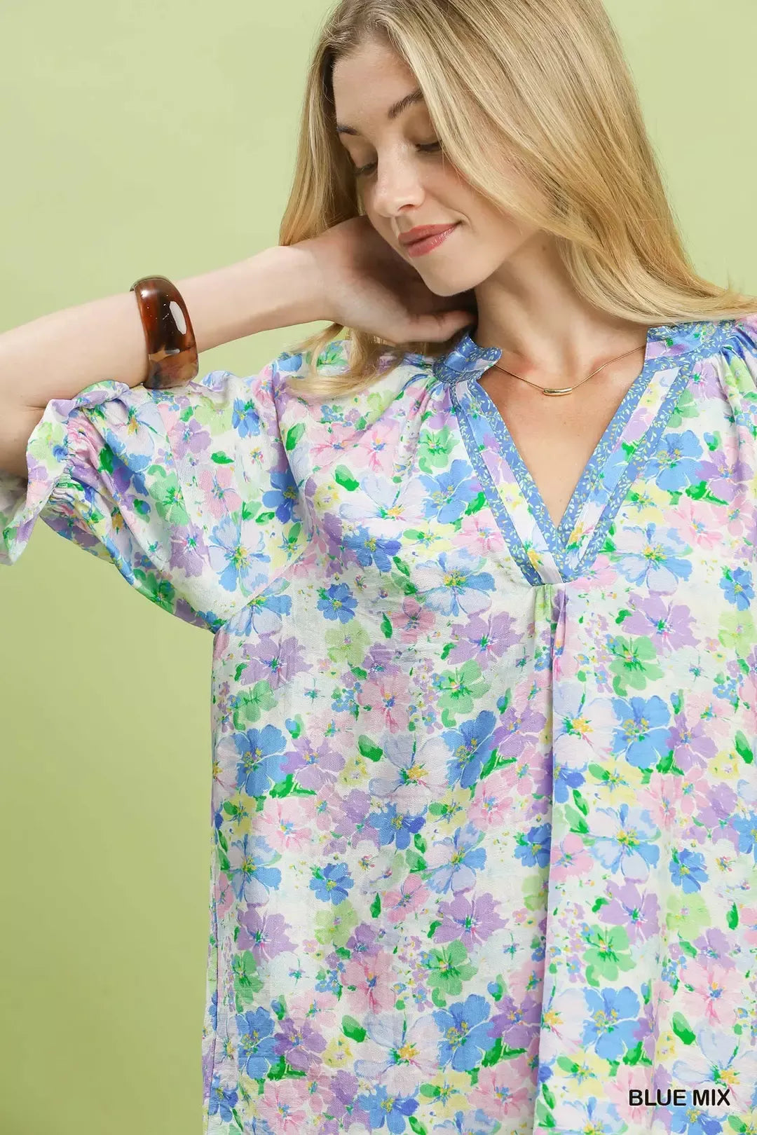 pastel floral ruffle sleeve blouse with lavender and blue watercolor flowers in a romantic boho style